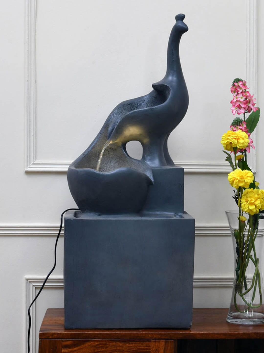 

Home Centre Grey Textured Standing Peacock Water Fountain
