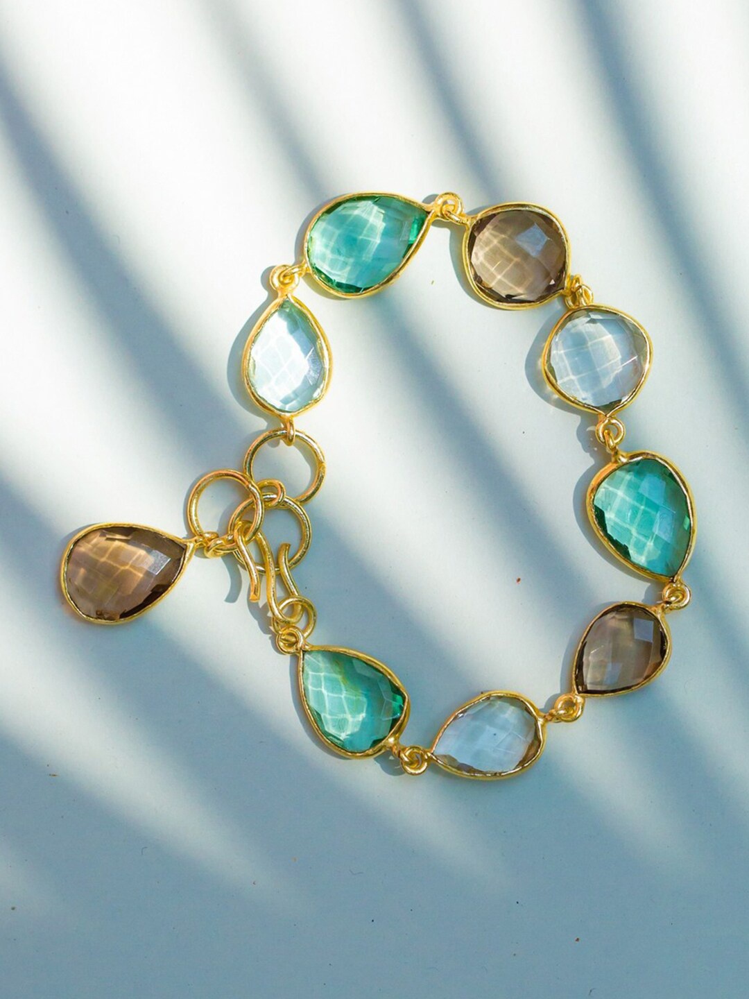 

Ishhaara Women Blue & Gold-Toned Earthy Delight Sparkler Bracelet