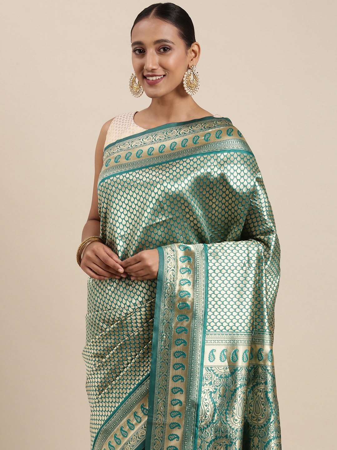 

Mitera Teal & Gold-Toned Ethnic Motifs Zari Silk Blend Banarasi Saree