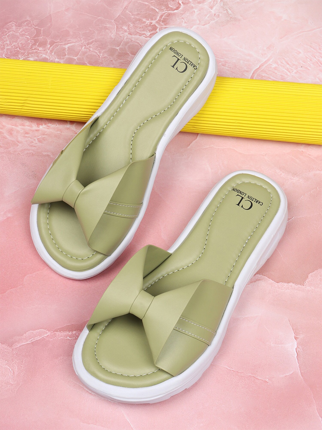 

Carlton London sports Women Green Solid Sliders
