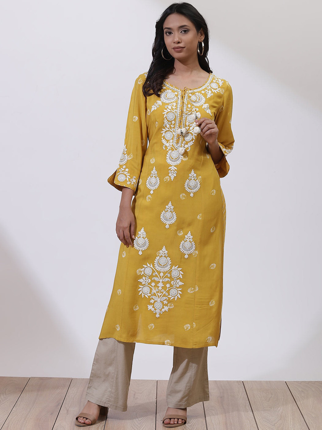 

Lakshita Women Mustard Yellow Floral Embroidered Keyhole Neck Flared Sleeves Thread Work Kaftan Kurta