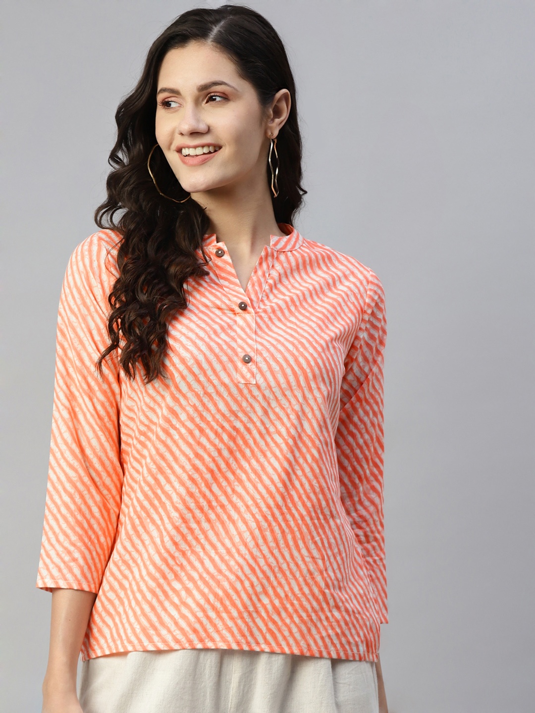 

MALHAAR Orange & White Leheriya Printed Pure Cotton Kurti