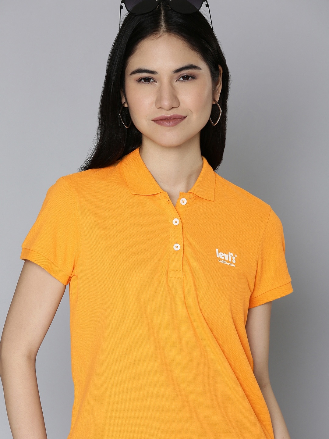 

Levis Women Orange Brand Logo Printed Polo Collar Pure Cotton T-shirt