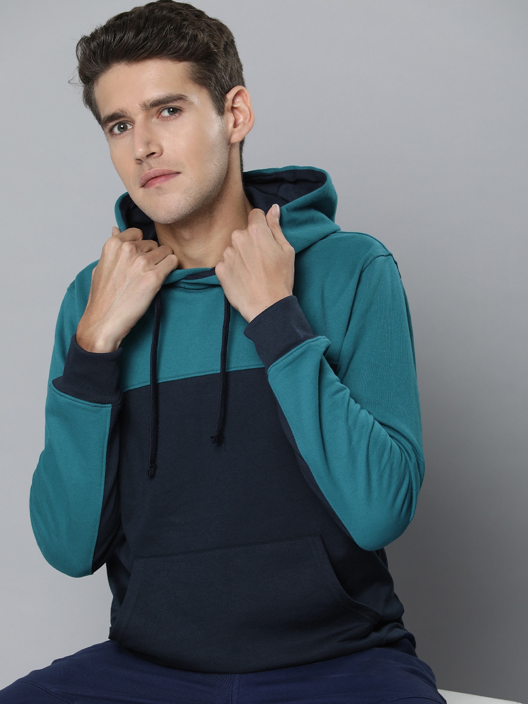 

Ether Men Blue Colourblocked Hooded Sweatshirt