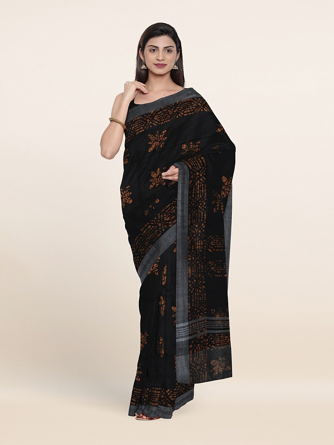 

Pothys Black & Orange Floral Jute Cotton Saree