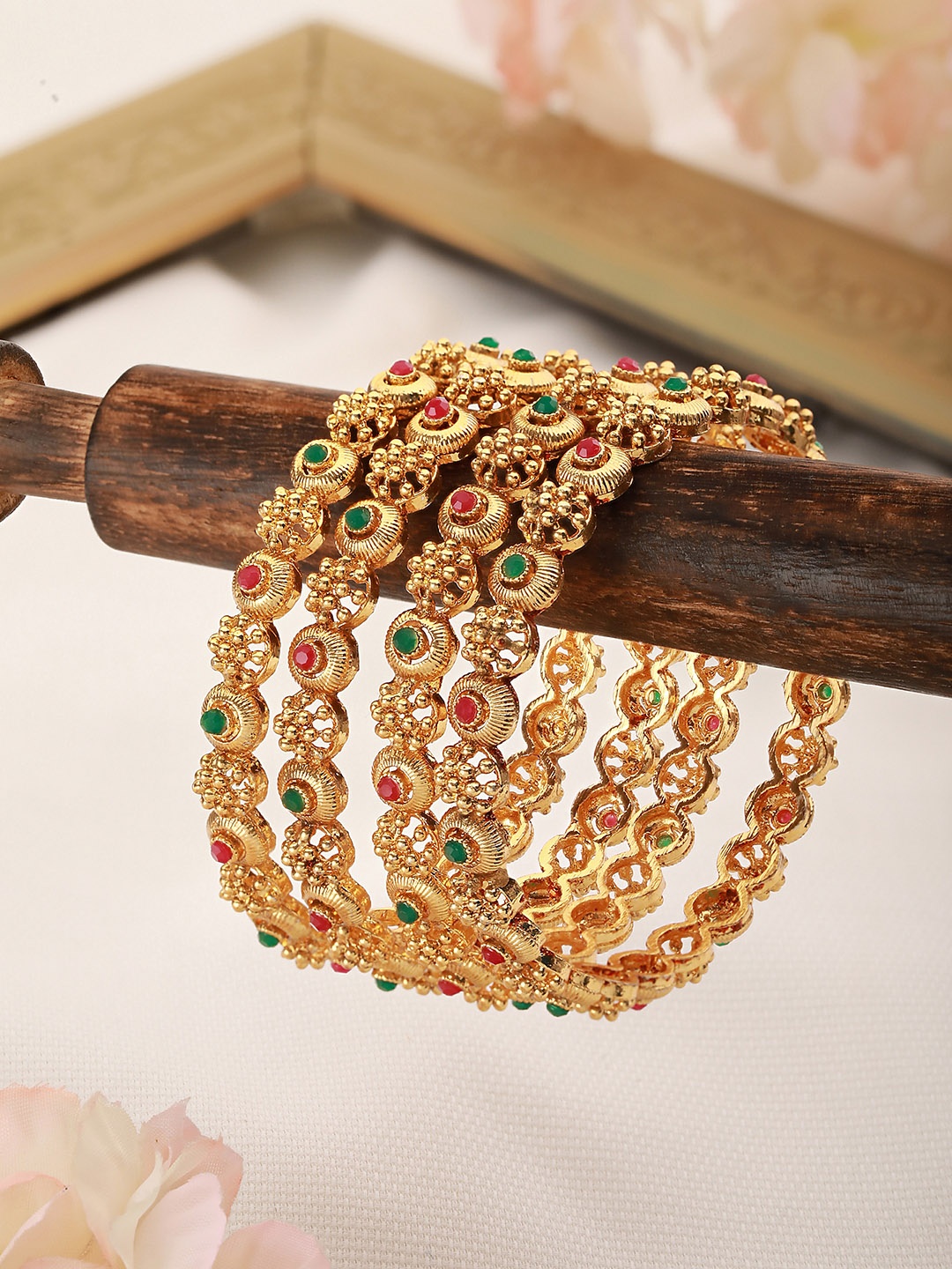 

Saraf RS Jewellery Set Of 4 Gold Plated & White AD Studded Designer Bangles