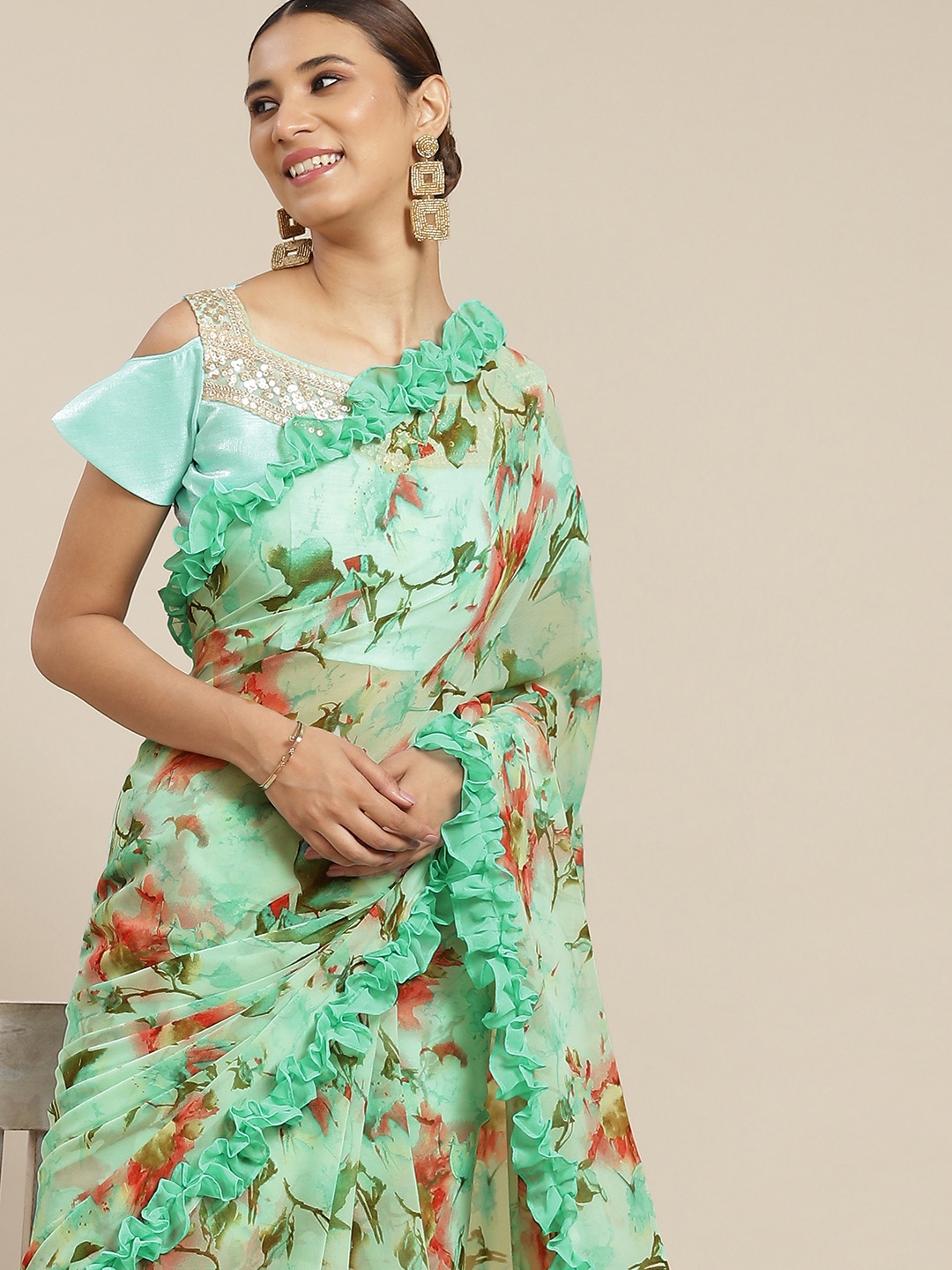 

Tikhi Imli Sea Green & Pink Floral Poly Georgette Saree With Frill