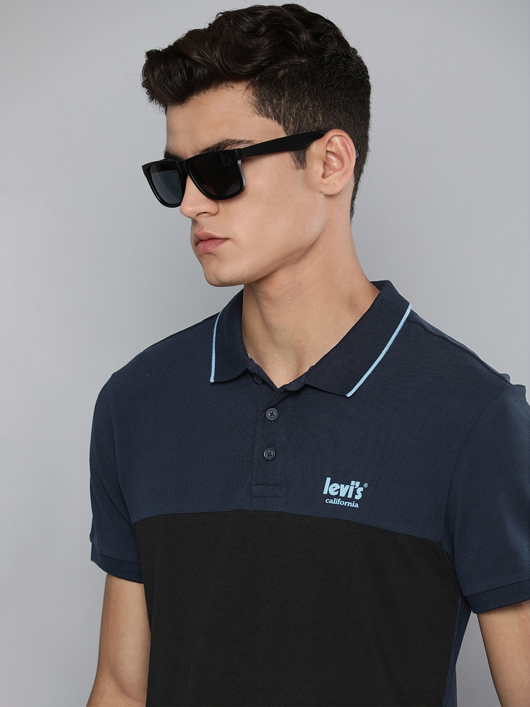 

Levis Men Navy Blue & Black Colourblocked Pure Cotton Polo Collar T-shirt