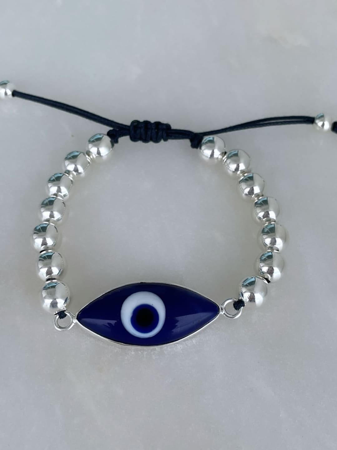 

MNSH Women Silver-Toned & Blue Brass Wraparound Evil Eye Bracelet