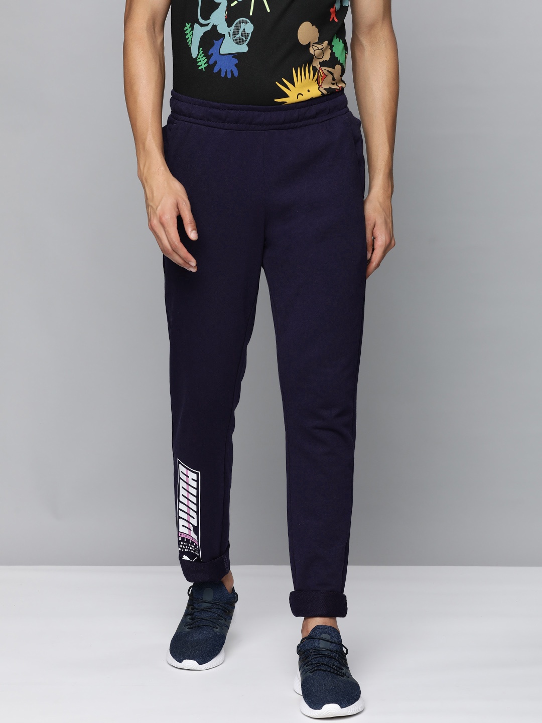 

Puma Men Typography Printed Slim Fit Regular Track Pants, Navy blue