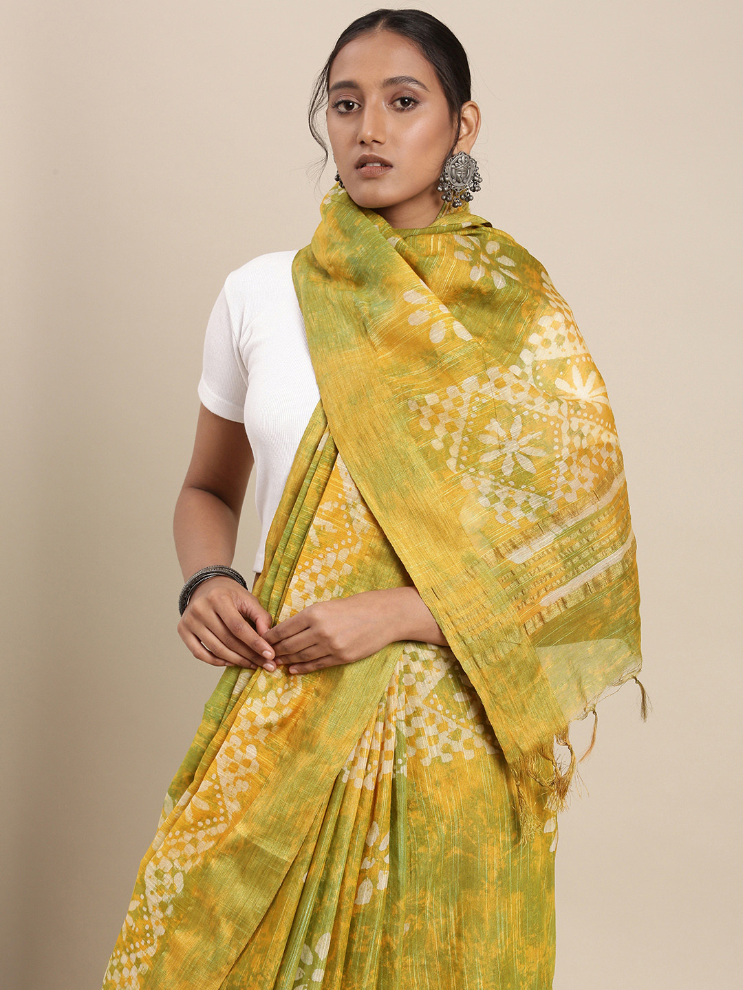 

Taavi Yellow & Green Batik Silk Blend Block Print Saree