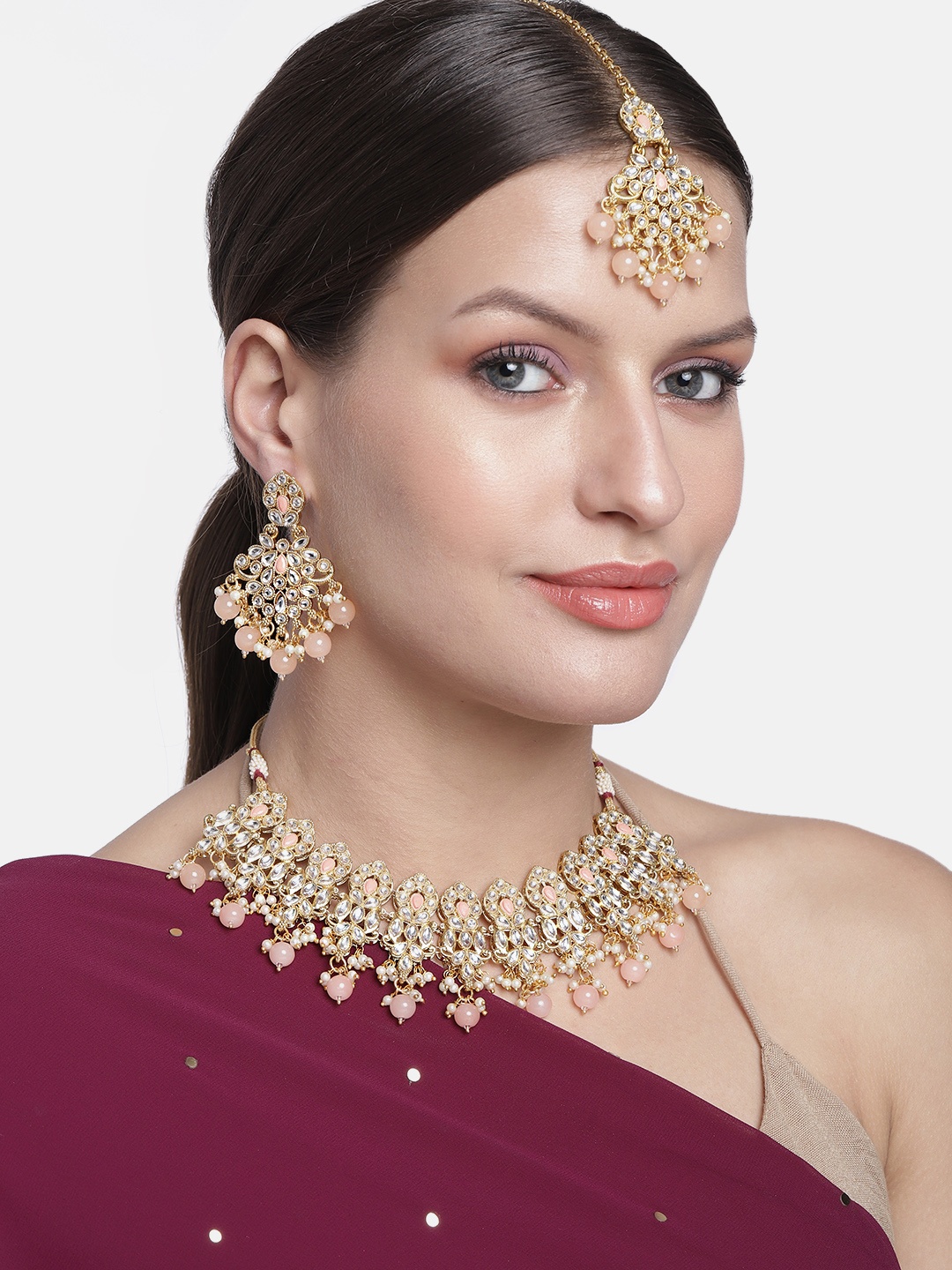 

Kord Store Gold-Plated & Peach-Coloured Traditional Stylist Kundan And Beads Jewellery Set