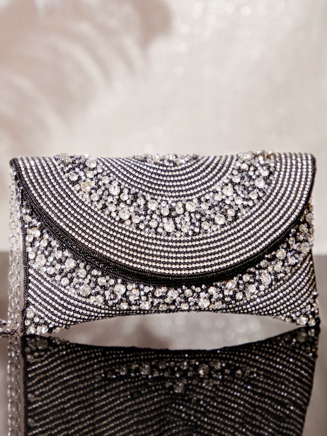 

Rubans Handcrafted Black Sling Bag with Intricate Bead Embroidery & Sparkling AD Stone