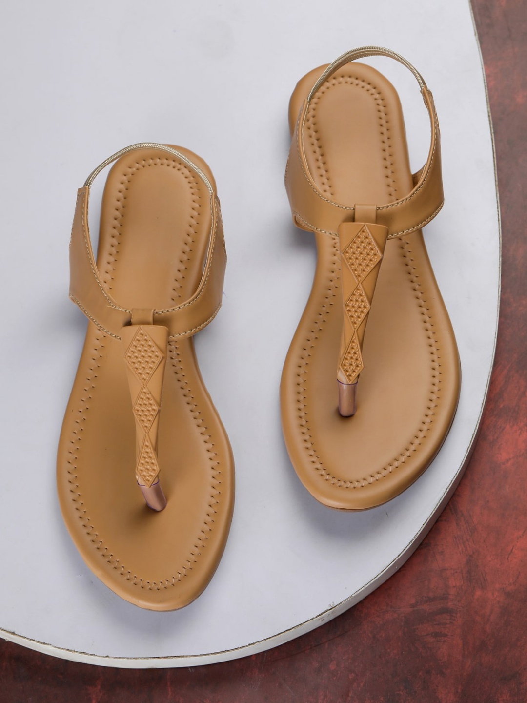 

Myra Women Brown T-Strap Flats with Laser Cuts