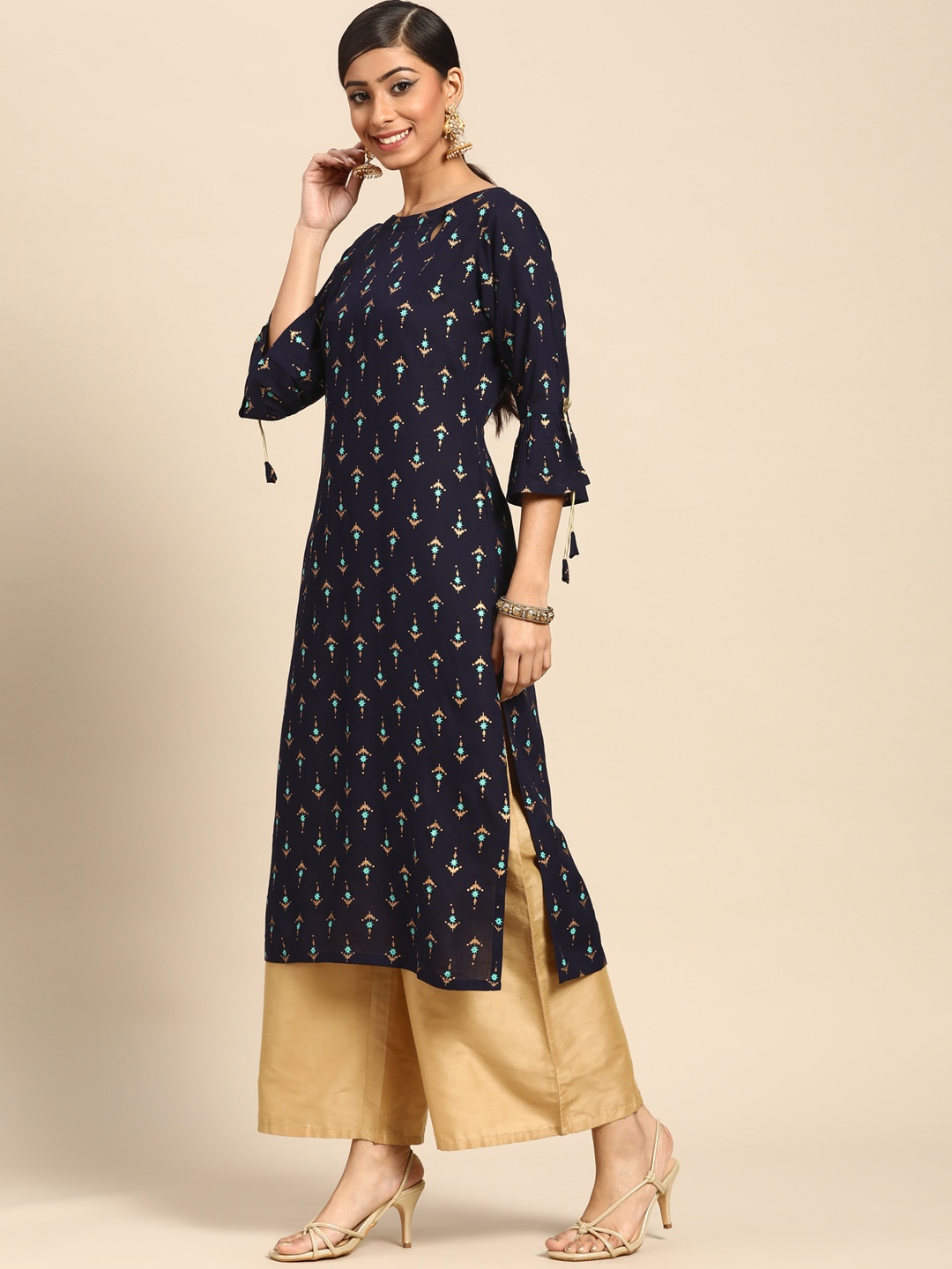 

Gerua By Libas Women Navy Blue Golden Ethnic Motifs Printed Bell Sleeves Kurta Tassels Detail