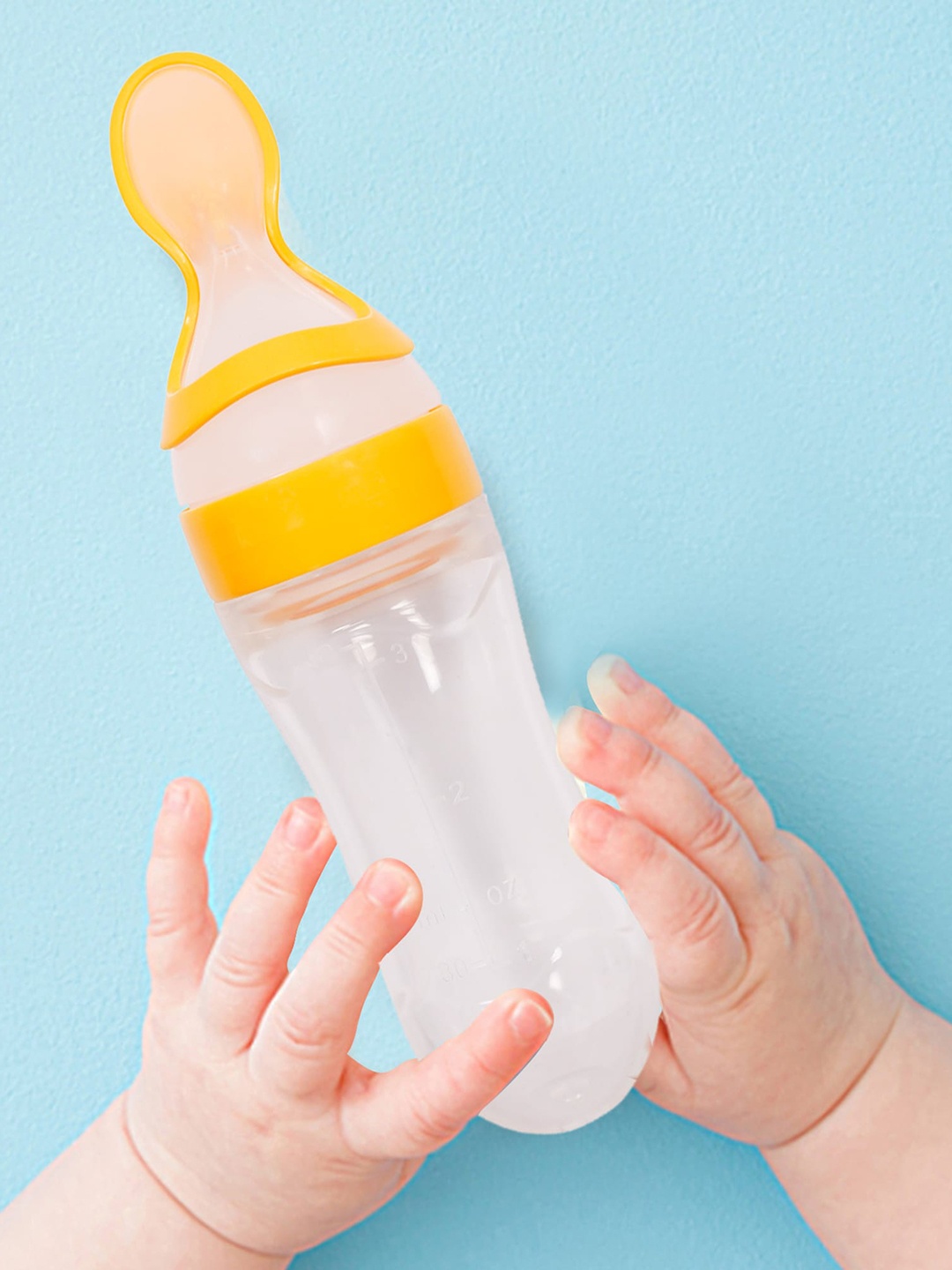 

Baby Moo Infant Kids Yellow Squeeze Bottle Feeder With Dispensing Spoon