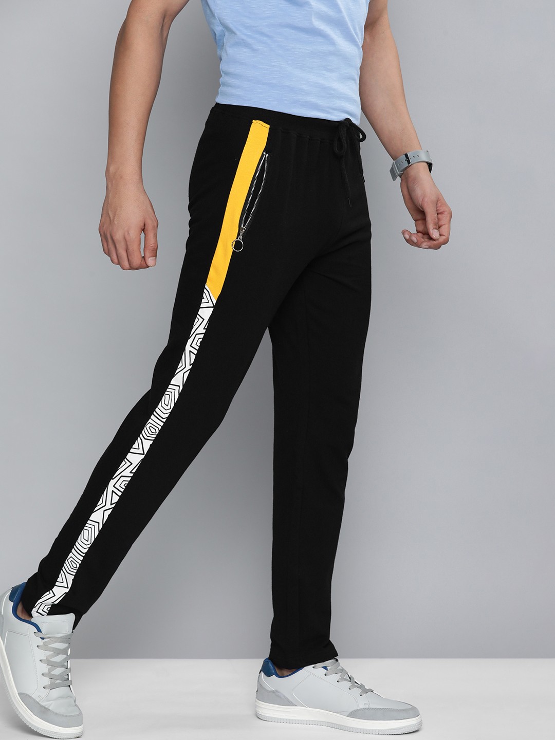 

HERE&NOW Men Black Solid Slim Fit Track Pants With Printed Contrast Side Stripes