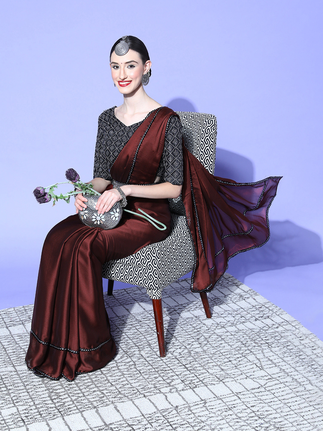 

Mitera Brown Solid Embellished Saree
