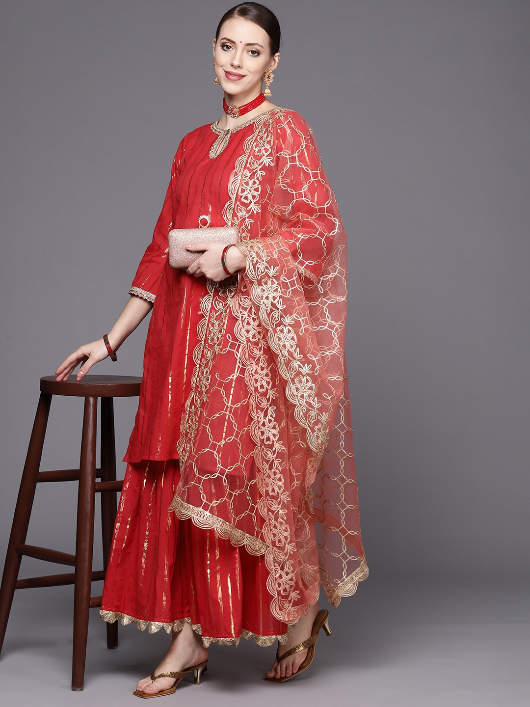 

Women Red Striped Kurta with Sharara & With Dupatta