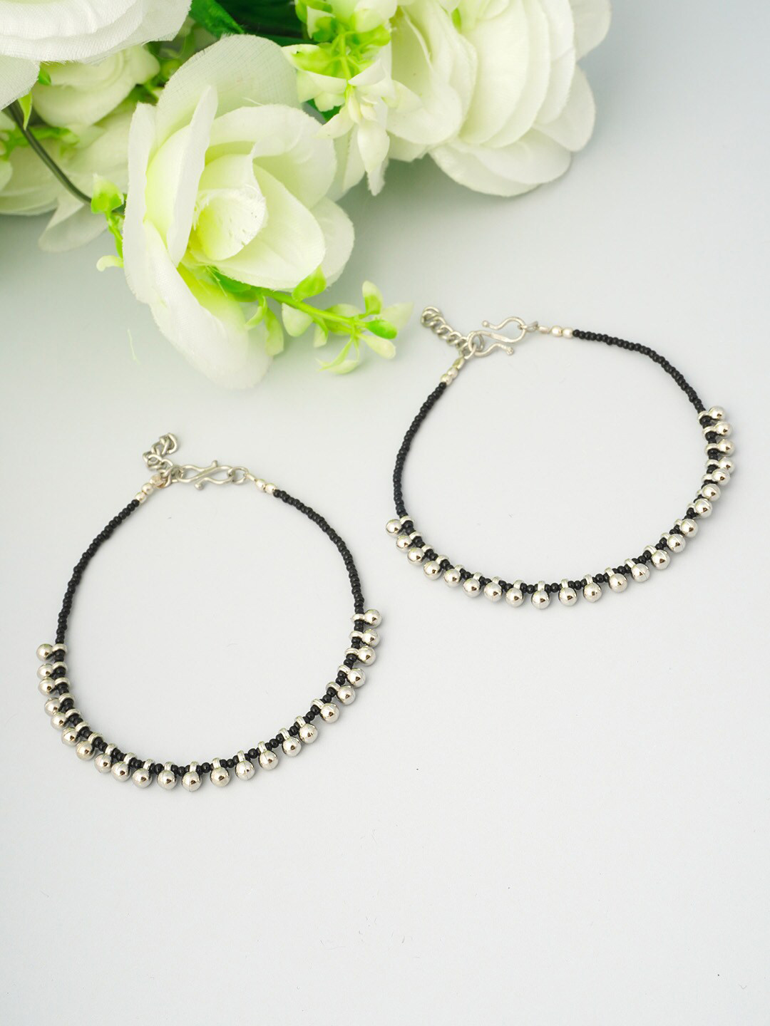 

Urmika Women Set of 2 Black & Silver Ghungroo Beaded Anklet