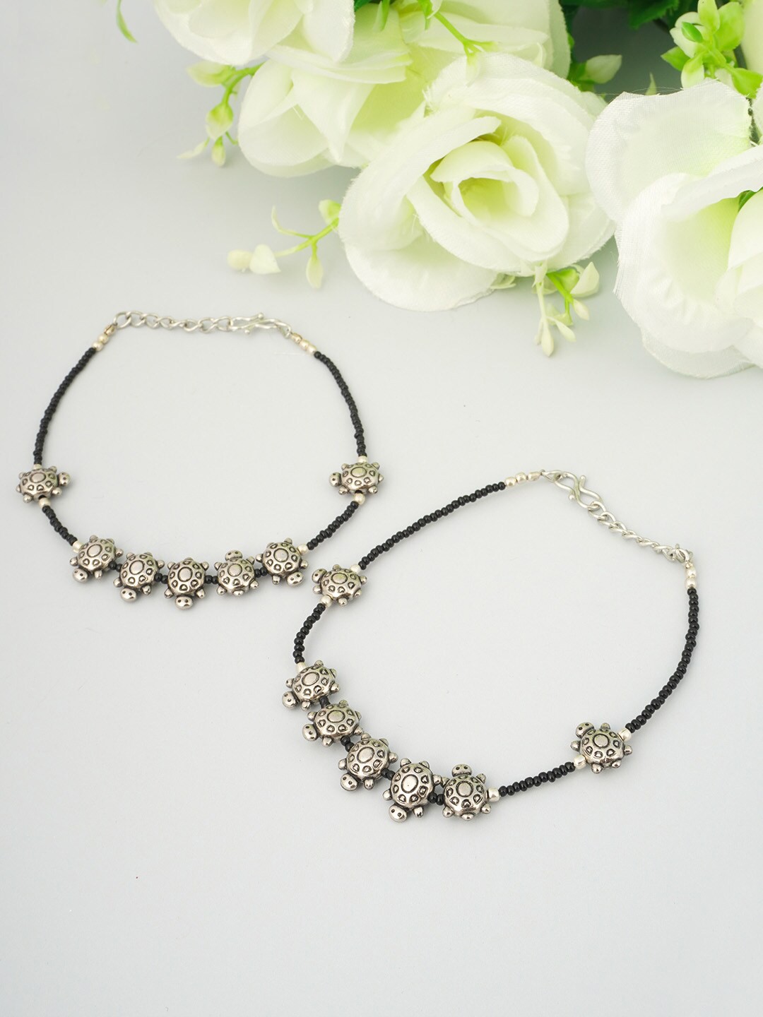 

Urmika Women Set of 2 Oxidised Black & Silver Turtle Beaded Anklet