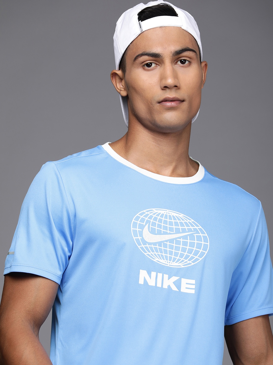 

Nike Men Blue & White Brand Logo & Colourblocked Printed Casual T-shirt