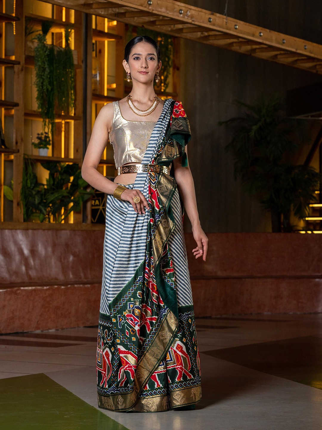 

BEATITUDE Green & Gold-Toned Ethnic Motifs Silk Blend Patola Saree