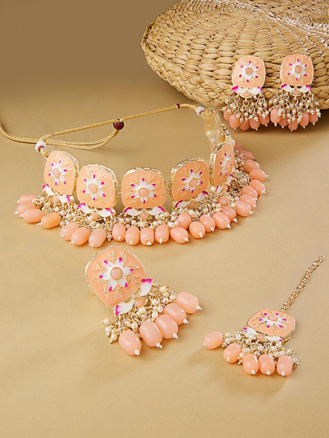 

Zaveri Pearls Gold-Plated Peach Stone-Studded& Beaded Jewellery Set