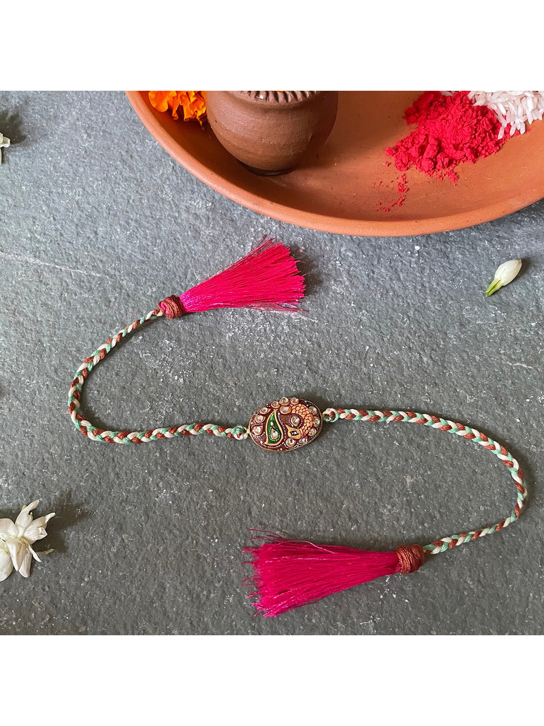 

Mitali Jain Brown & Pink Beaded Tanjore Rakhi