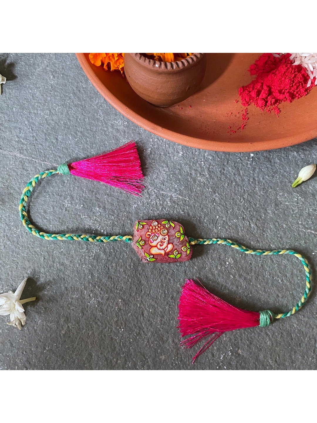 

Mitali Jain Green & Pink Hand-Painted Ganesh Charm Rakhi