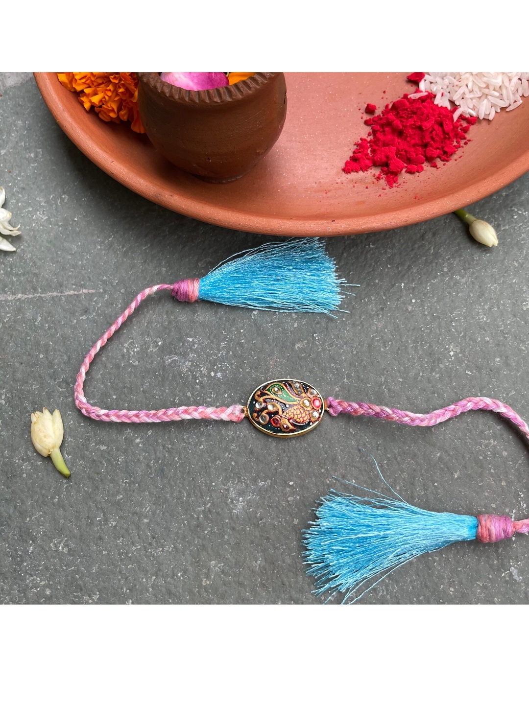 

Mitali Jain Blue Embellished Tanjore Rakhi