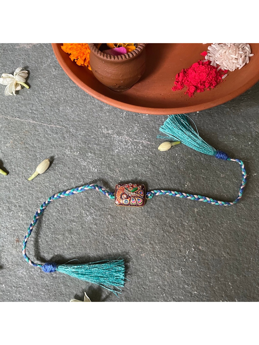 

Mitali Jain Sea Green Embellished Tanjore Rakhi