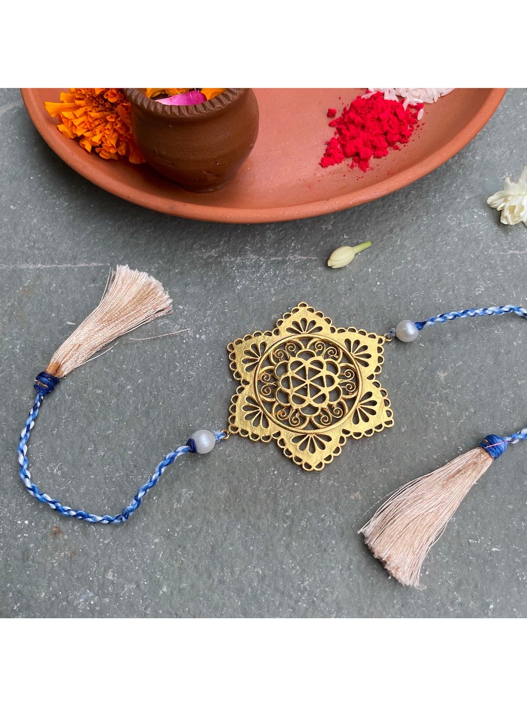 

Mitali Jain Gold Gul Bahaar Handcrafted Rakhi