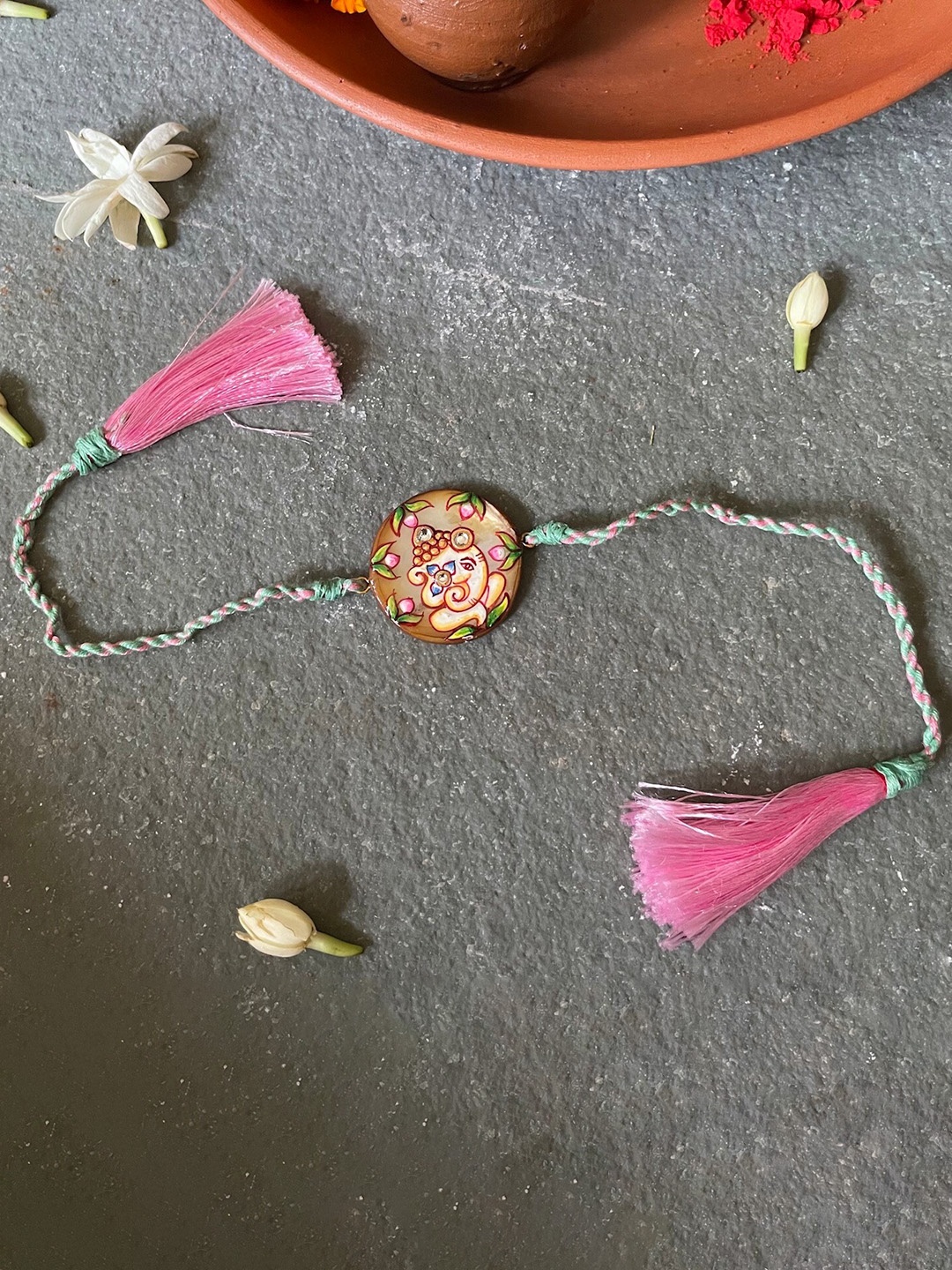 

Mitali Jain Pink Ganesh Handpainted Rakhi