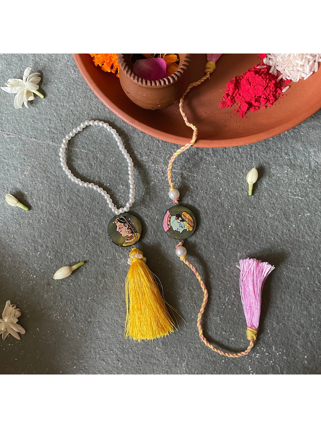 

Mitali Jain Yellow & Pink Handpainted Rakhi Lumba Set