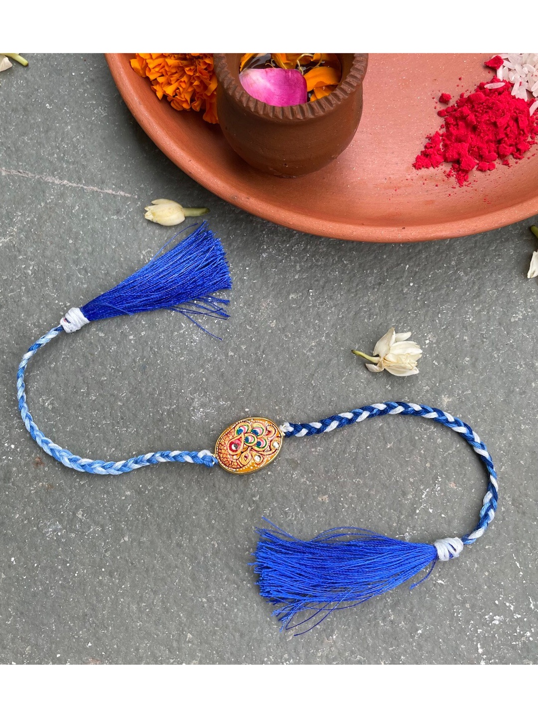 

Mitali Jain Blue & White Printed Beaded Tanjore Rakhi