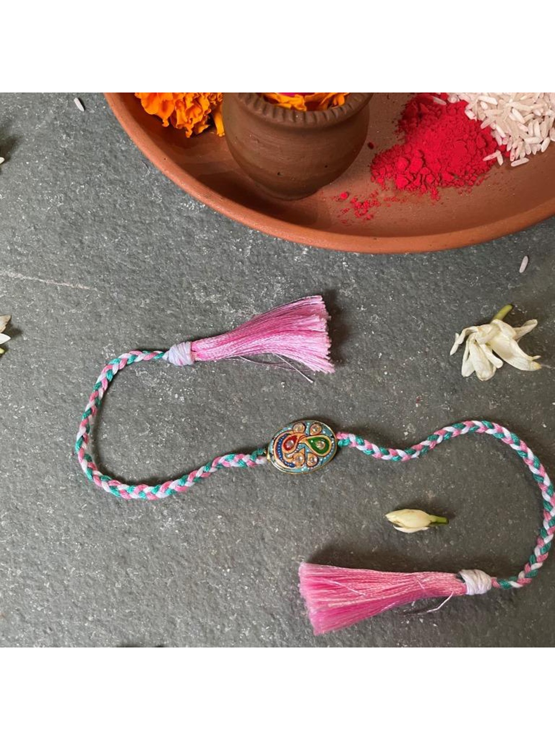 

Mitali Jain Blue & Pink Tanjore Rakhi