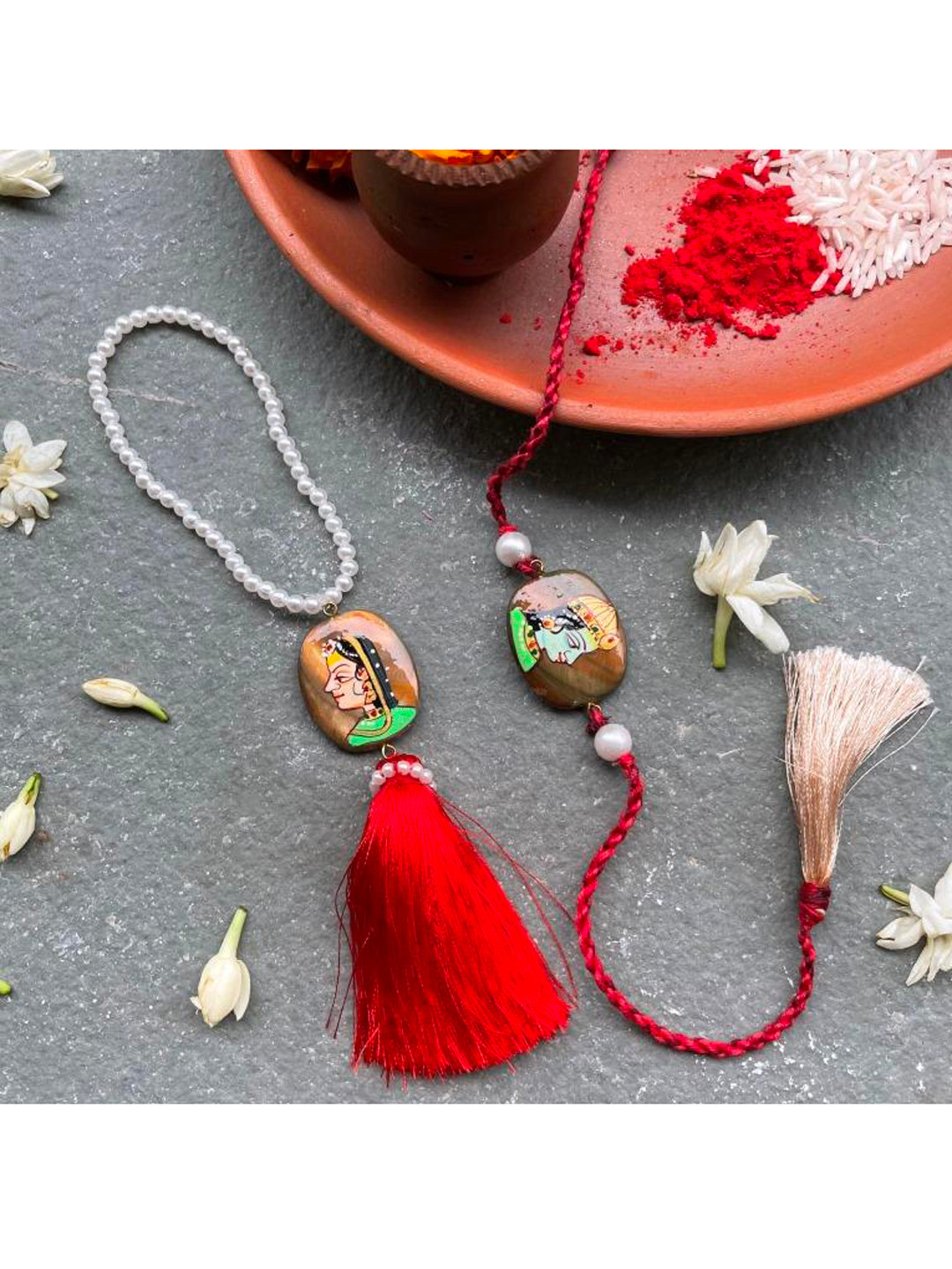 

Mitali Jain Red and Brown Handpainted Rakhi Lumba Set