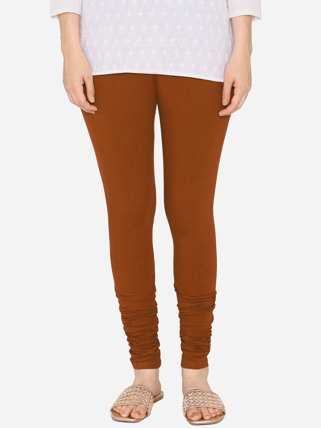 

Vami Women Orange Solid Churidar-Length Leggings