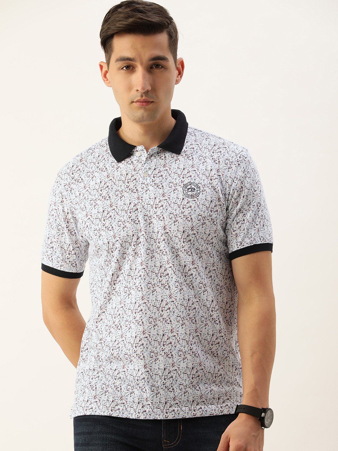 

Peter England Men White & Brown Abstract Printed Polo Collar T-shirt