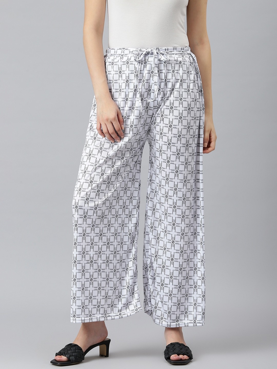 

Aarika Women White & Black Pure Cotton Geometric Print Flared Ethnic Palazzos