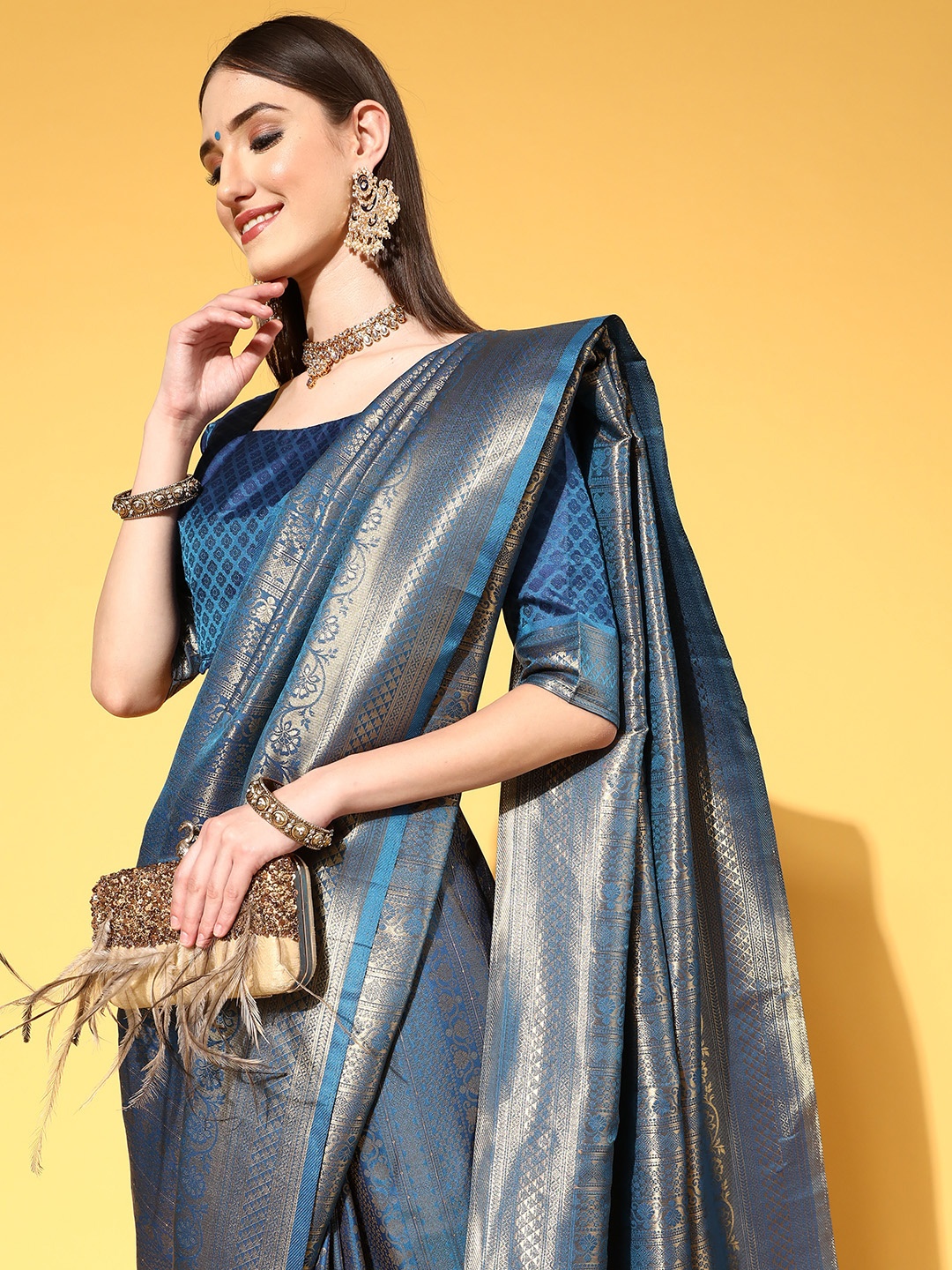 

Saree mall Blue & Golden Ethnic Motifs Silk Blend Sarees