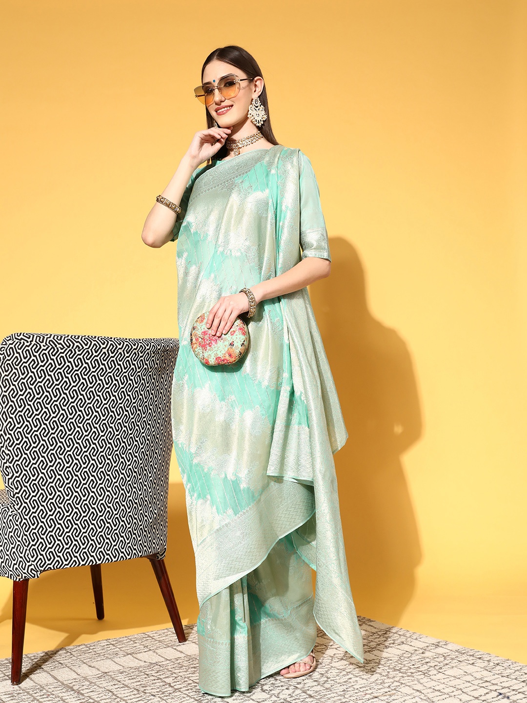 

Saree mall Turquoise Blue & Golden Ethnic Motifs Silk Blend Sarees