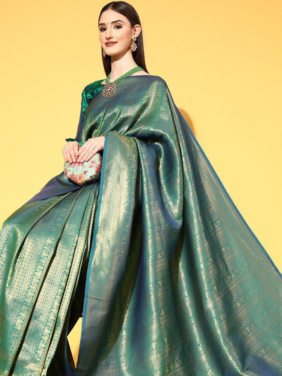 

Saree mall Teal Blue & Golden Ethnic Motifs Silk Blend Sarees