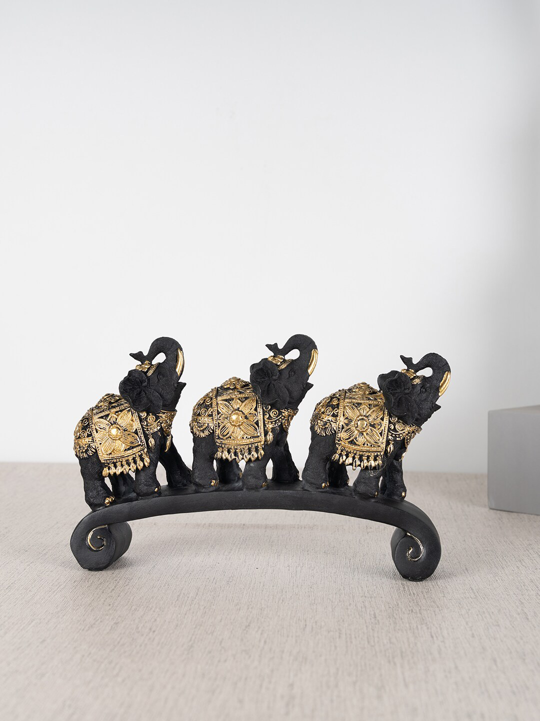 

HomeTown Black Three Elephant On Platform Show Piece