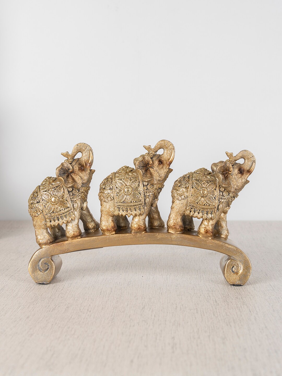 

HomeTown Gold-Toned Three Elephant On Platform Figurine