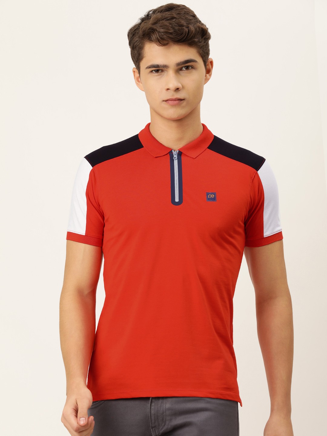 

Peter England Men Orange Polo Collar T-shirt