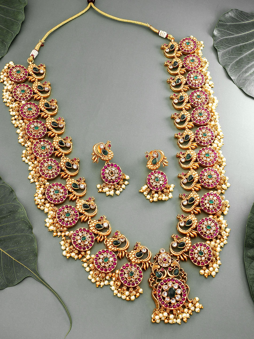 

aadita Gold-Plated Pink & Green Stone-Studded & Beaded Temple Jewellery Set