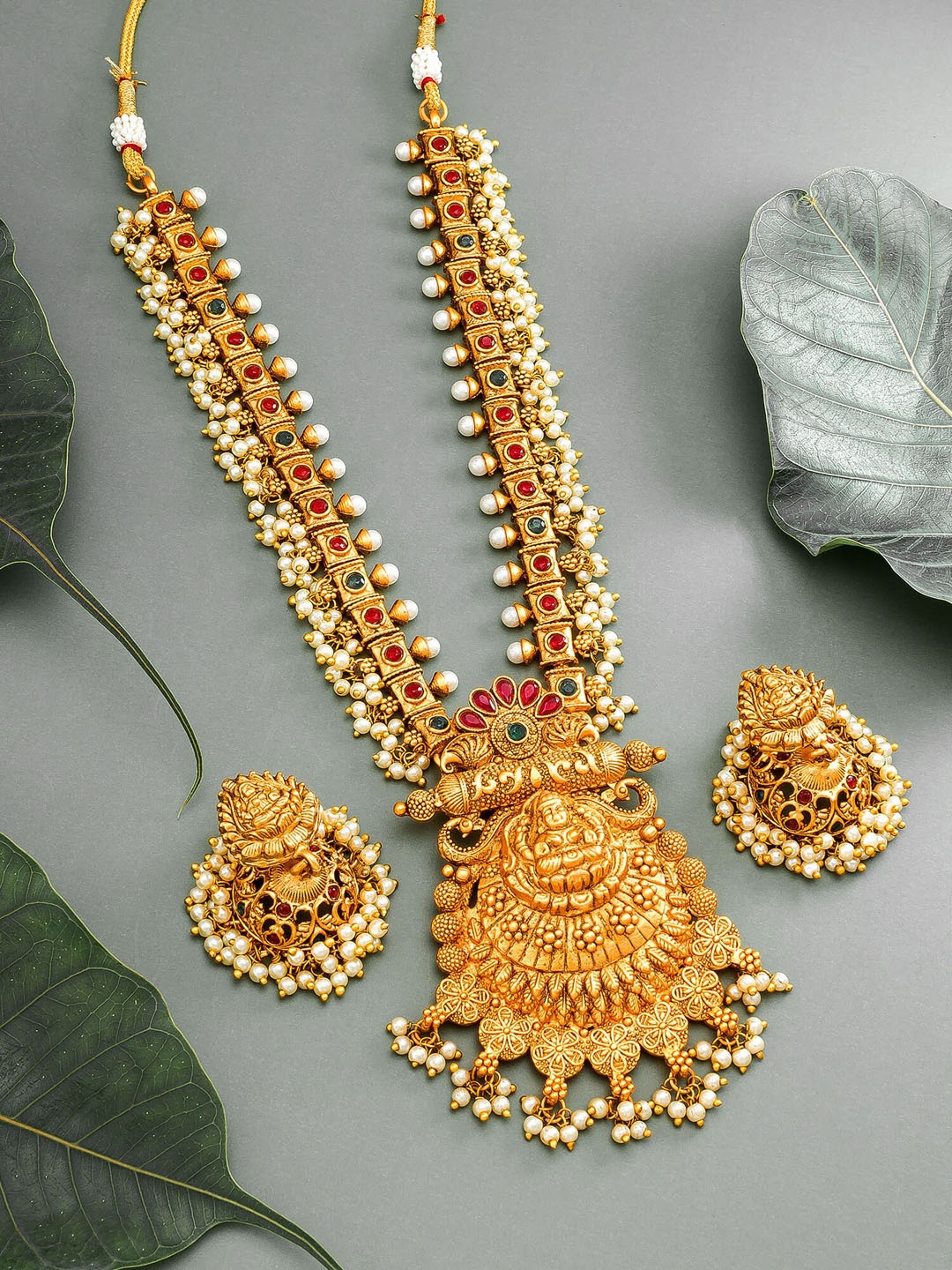 

aadita Gold-Plated Red & Green Stone-Studded & Pearl Beaded Temple Jewellery Set