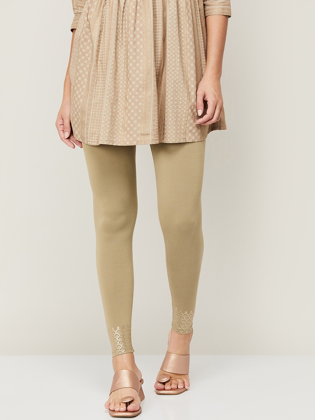 

Melange by Lifestyle Women Gold-Toned Solid Leggings